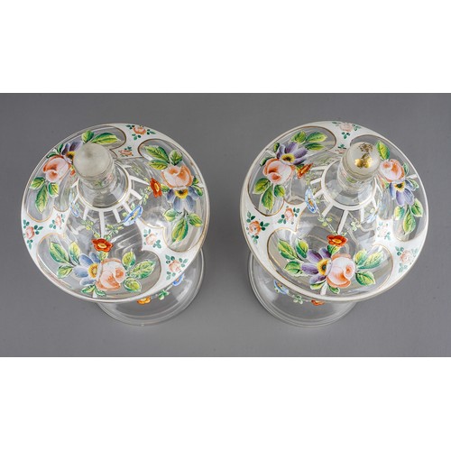 528 - A pair of late 19th Century Venetian glass jars and covers, enameled with colourful flowers, knop fi... 