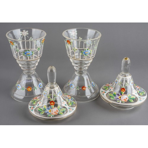 528 - A pair of late 19th Century Venetian glass jars and covers, enameled with colourful flowers, knop fi... 