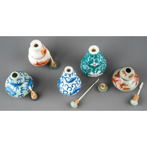 529 - A collection of Chinese porcelain double gourd snuff bottles, including celadon ground, blue and whi... 