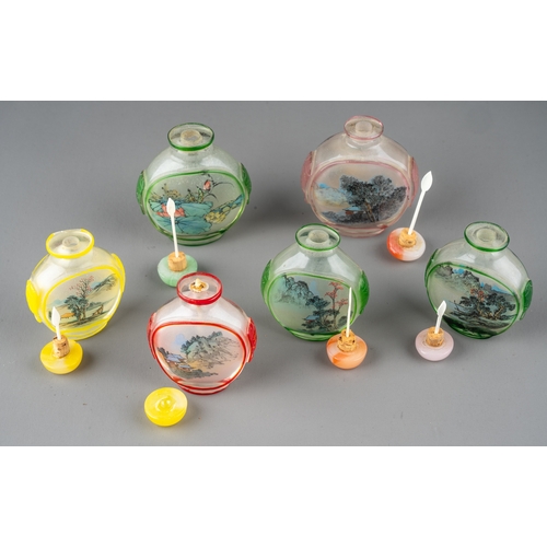 530 - A collection of Chinese clear glass snuff bottles, each reverse painted depicting traditional scenes... 