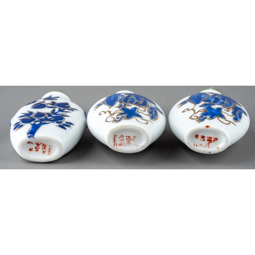 534 - A collection of Chinese porcelain snuff bottles, including a pair of ovoid bottles enameled with blu... 