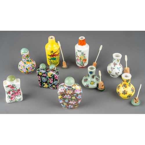 535 - A collection of Chinese porcelain snuff bottles, of various shapes and designs, including baluster s... 