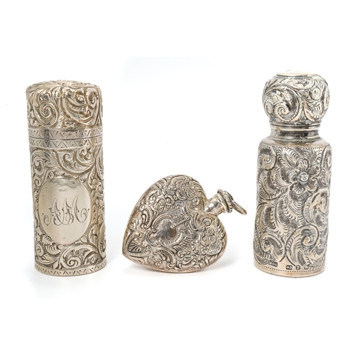 550 - A Victorian cylindrical silver scent bottle, embossed with foliate scrolls, gilt lined, hinged cover... 