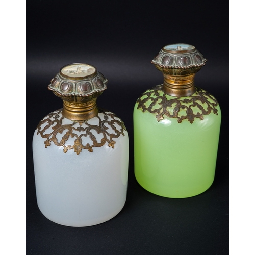 551 - A pair of 19th century continental glass scent bottles, one green uranium and one white, each having... 