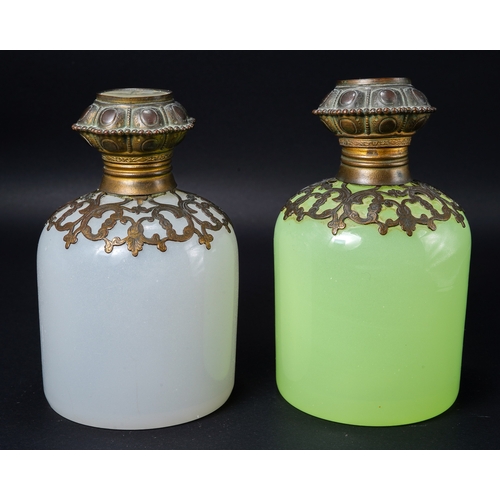 551 - A pair of 19th century continental glass scent bottles, one green uranium and one white, each having... 