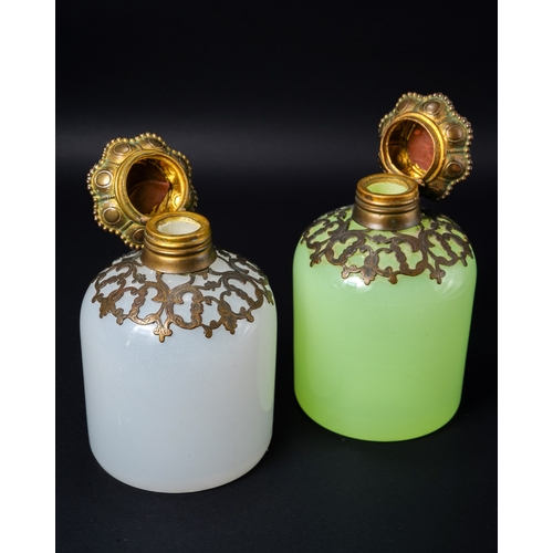 551 - A pair of 19th century continental glass scent bottles, one green uranium and one white, each having... 