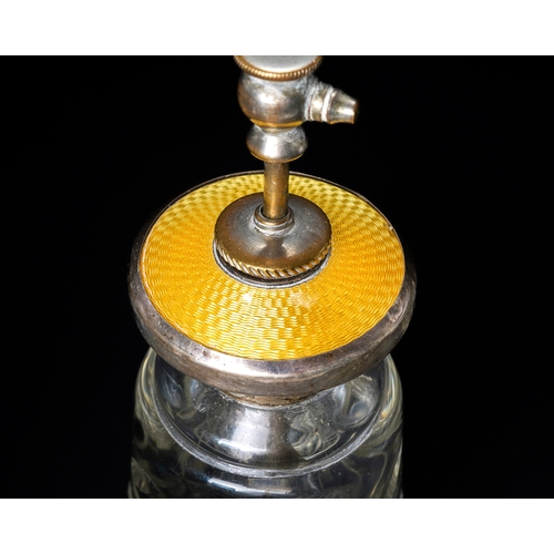 554 - An Art Deco sterling silver and yellow enamel atomiser, cut glass bottle, approx 16.5cm high; togeth... 