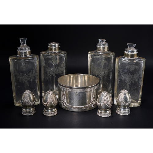 559 - A set of four French silver-mounted engraved glass scent-bottles, first quarter 20th Century, the fo... 