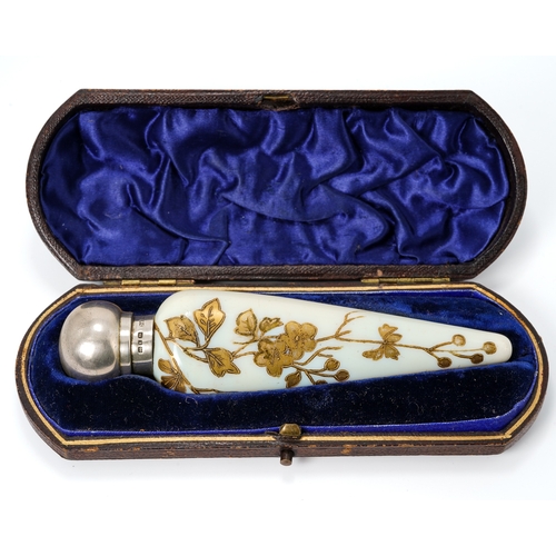 561 - A Victorian silver mounted opaque glass scent bottle, of conical form with gilt foliate detail, silv... 