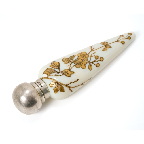 561 - A Victorian silver mounted opaque glass scent bottle, of conical form with gilt foliate detail, silv... 