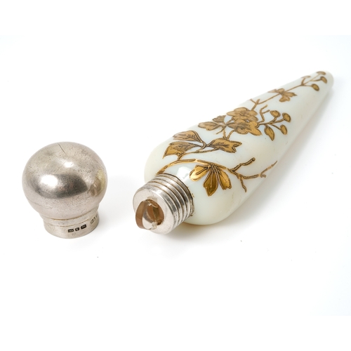 561 - A Victorian silver mounted opaque glass scent bottle, of conical form with gilt foliate detail, silv... 