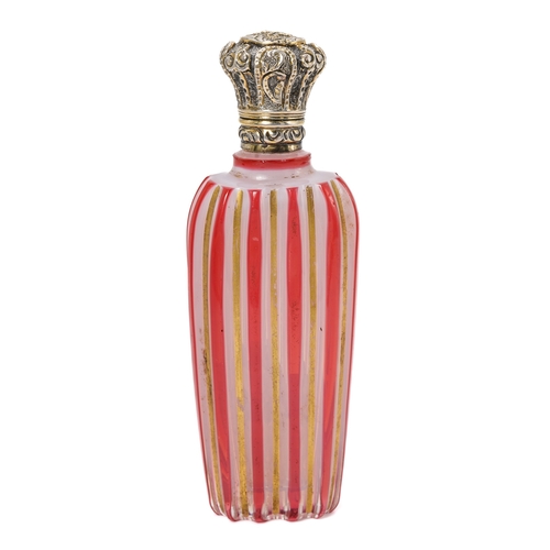 562 - A 19th century milch glass scent bottle, with ruby flash and gilt stripes, silver hinged cover, appr... 