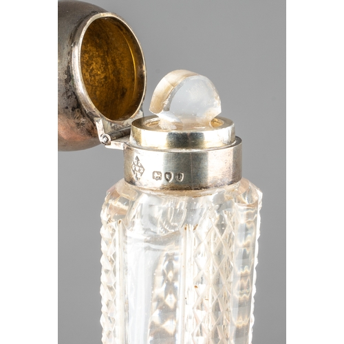 568 - A late Victorian silver mounted cut glass scent flask of tapered form, the hinged cover engraved wit... 