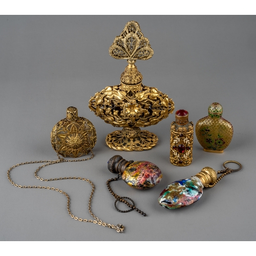 570 - A collection of gilt metal mounted scent and snuff bottles, including a Chinese snuff bottle with fi... 