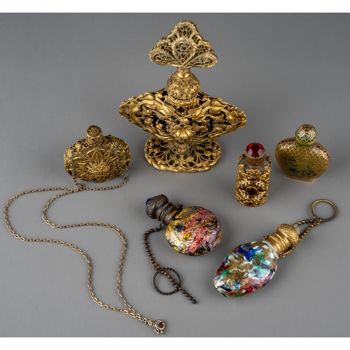 570 - A collection of gilt metal mounted scent and snuff bottles, including a Chinese snuff bottle with fi... 