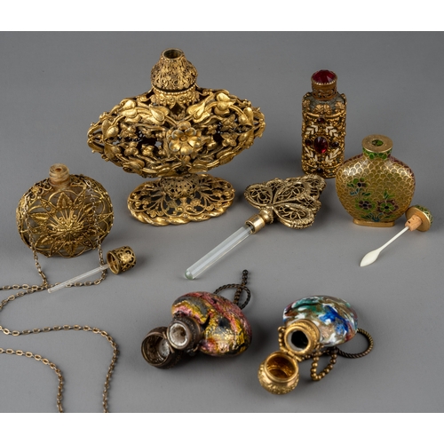 570 - A collection of gilt metal mounted scent and snuff bottles, including a Chinese snuff bottle with fi... 