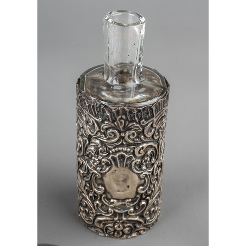 571 - A collection of nine glass scent bottles including two cut glass globular bottles with screw-on silv... 