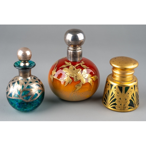 573 - A globular coloured glass scent bottle, in tones of burnt orange and yellow, applied with foliate gi... 