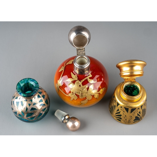 573 - A globular coloured glass scent bottle, in tones of burnt orange and yellow, applied with foliate gi... 