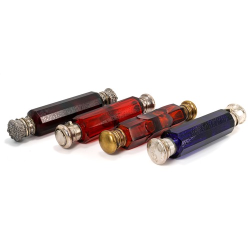 575 - A collection of four Victorian double-ended glass scent bottles, including three red and one blue, t... 