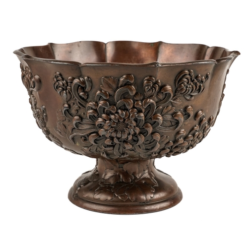 582 - Japanese bronzed pedestal bowl decorated with flowers, marked to base, approx. 18.5 cm in diameter  ... 