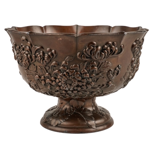 582 - Japanese bronzed pedestal bowl decorated with flowers, marked to base, approx. 18.5 cm in diameter  ... 