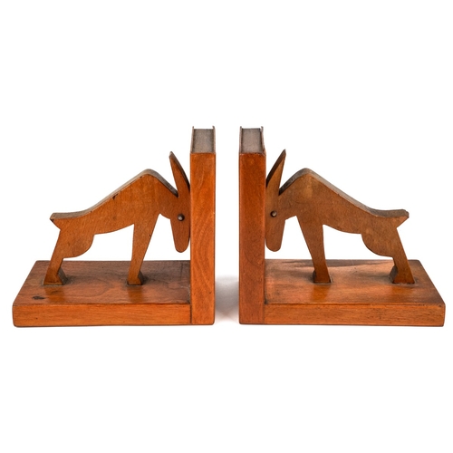 584 - A pair of mid century carved wood book ends in a form of an abstract animals. The ends and sides des... 