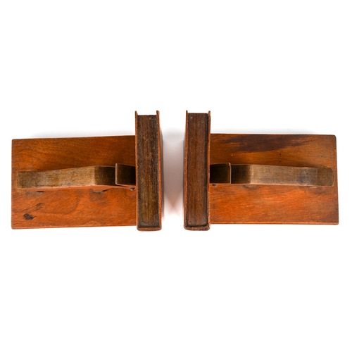 584 - A pair of mid century carved wood book ends in a form of an abstract animals. The ends and sides des... 