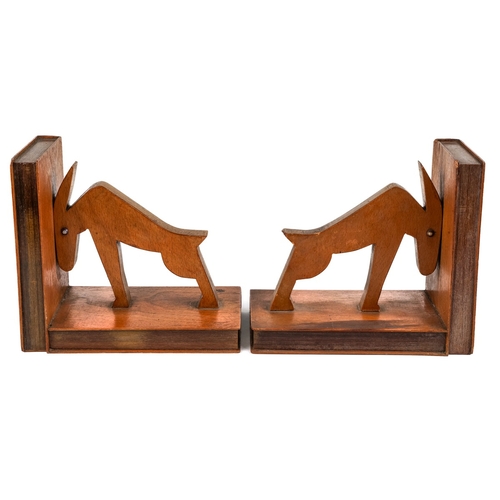 584 - A pair of mid century carved wood book ends in a form of an abstract animals. The ends and sides des... 