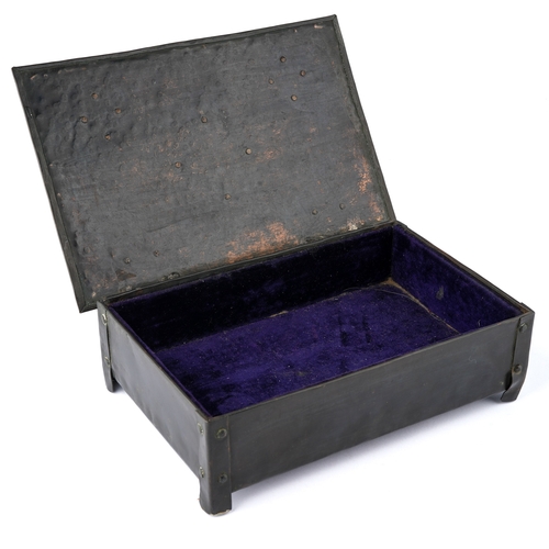 585 - An Arts and Crafts rectangular copper box, the hammered cover with strapwork hinges, central raised ... 