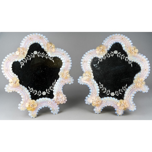 594 - A pair of early 20th Century Murano easel back mirrors, cartouche shaped applied with flowers, appro... 