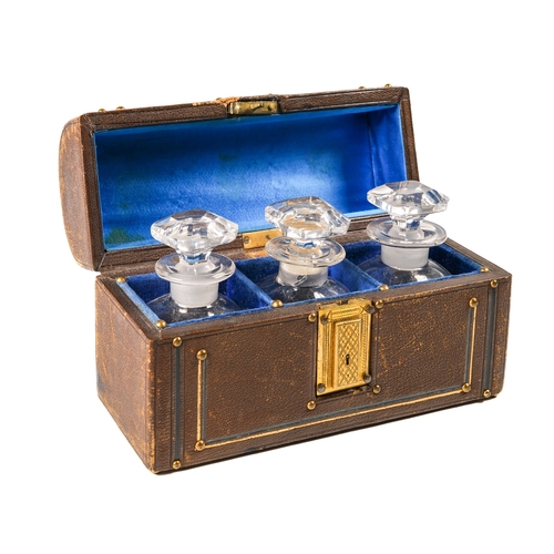 595 - A Victorian leather domed casket, applied with brass fittings, the top inlaid with a Jasper ware cam... 