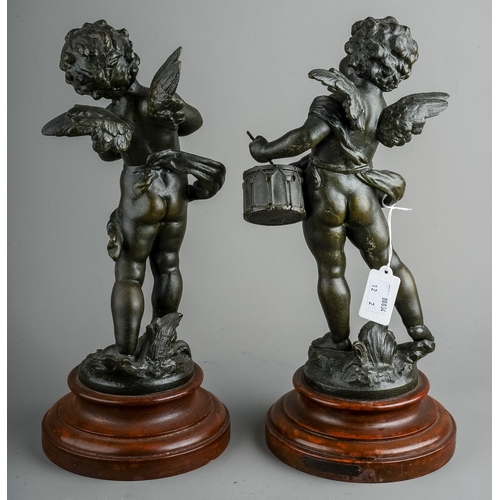 596 - A pair of French decorative bronzed spelter figures of cherubs playing the cymbals or drum, on paint... 