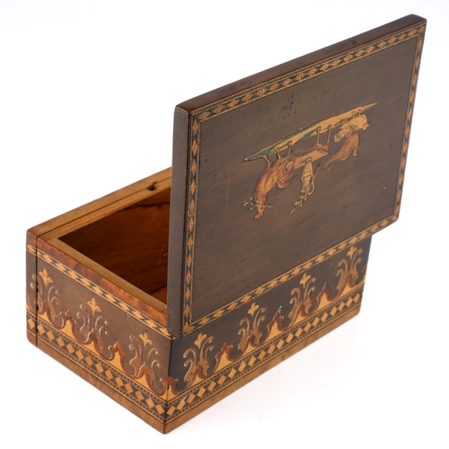 600 - An Italian vari-wood inlaid box, the cover with cockerels and fowl by a table within diamond banding... 