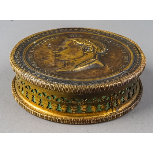 605 - A 19th Century French Napoleonic leather and brass circular snuff box with profile of Emperor Napole... 