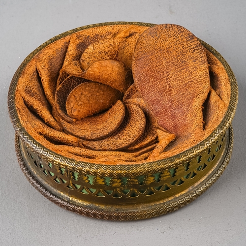 605 - A 19th Century French Napoleonic leather and brass circular snuff box with profile of Emperor Napole... 