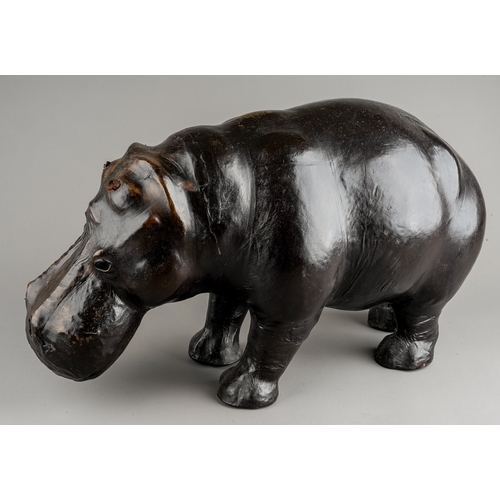 613 - A leather Hippopotamus in the manner of Liberty footstool, with glass eyes. approx. 45cm long x 26cm... 