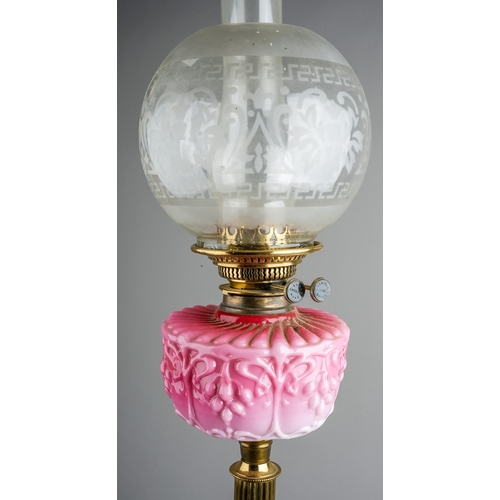 639 - A Victorian style brass oil lamp on reeded column base, with pink moulded glass reserve, etched glas... 