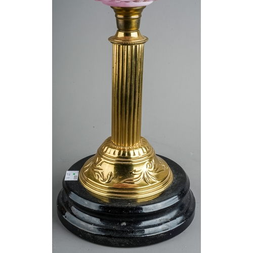 639 - A Victorian style brass oil lamp on reeded column base, with pink moulded glass reserve, etched glas... 