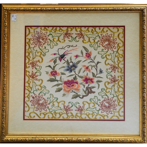 664 - A framed Chinese silk panel with gold thread embroidery framing with a bird and pink flowers, 36 x 3... 