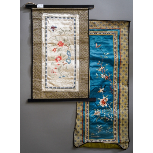 664 - A framed Chinese silk panel with gold thread embroidery framing with a bird and pink flowers, 36 x 3... 