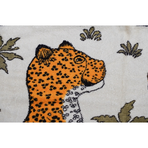 668 - A vintage Hermes beach towel depicting leopards, label to reverse