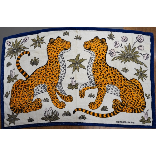 668 - A vintage Hermes beach towel depicting leopards, label to reverse