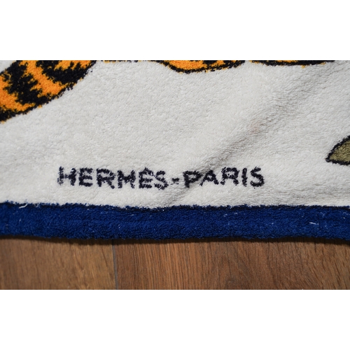 668 - A vintage Hermes beach towel depicting leopards, label to reverse