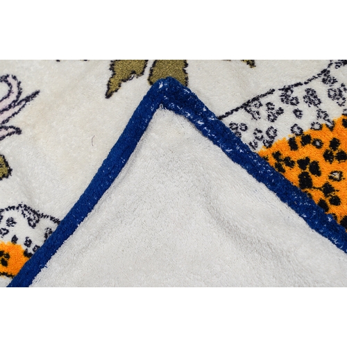 668 - A vintage Hermes beach towel depicting leopards, label to reverse