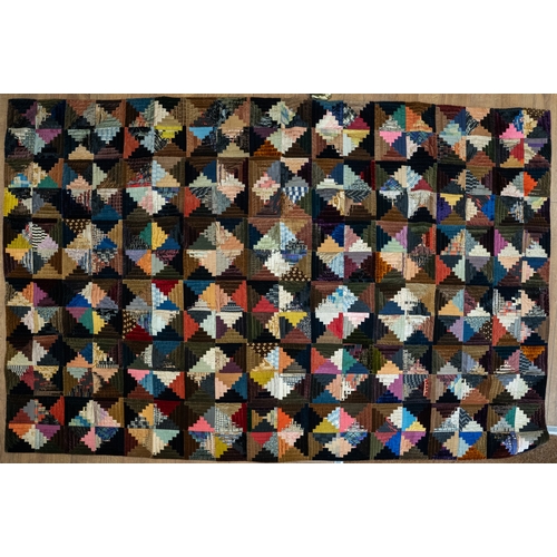 669 - A Victorian silk and velvet patchwork bedspread circa 1860's with geometric pattern, backed, approx ... 