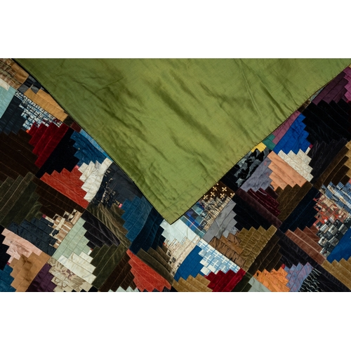 669 - A Victorian silk and velvet patchwork bedspread circa 1860's with geometric pattern, backed, approx ... 