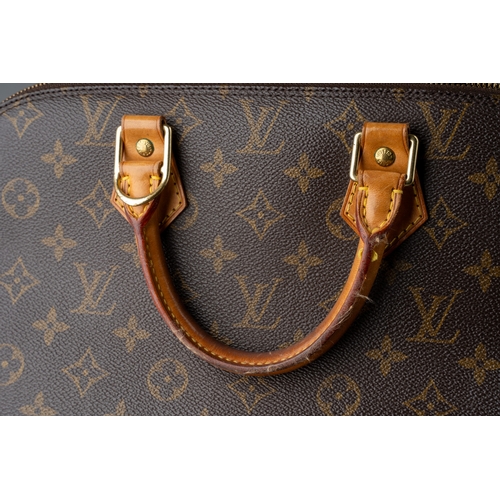 676 - Louis Vuitton - a monogram Alma handbag, the domed shaped satchel designed with maker's classic mono... 