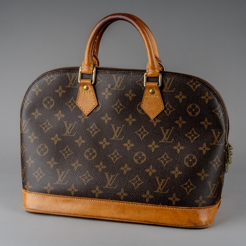 676 - Louis Vuitton - a monogram Alma handbag, the domed shaped satchel designed with maker's classic mono... 