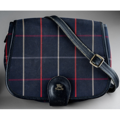 677 - Burberry bags - two canvas saddle bags, both of the same design, to include a beige checked canvas e... 